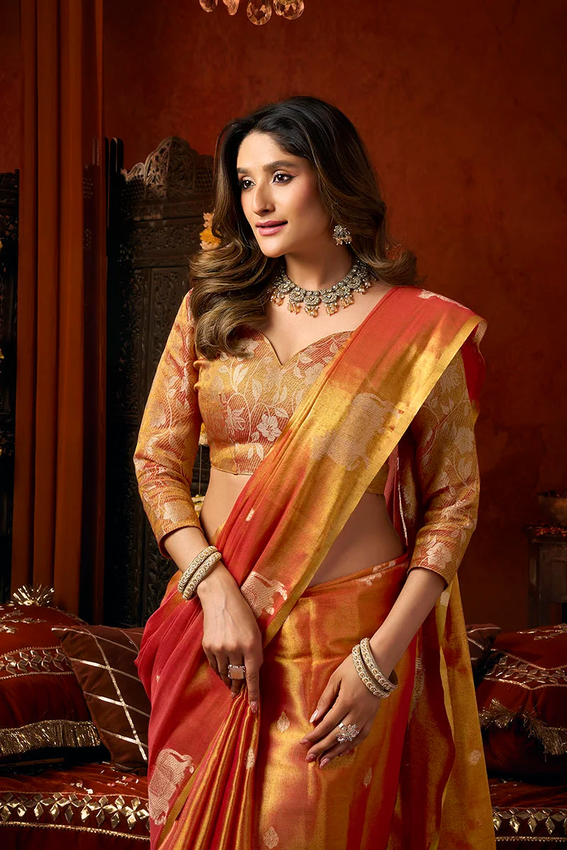 Orange Tissue Saree with Cow Motif Pallu, blouse and pallu close-up