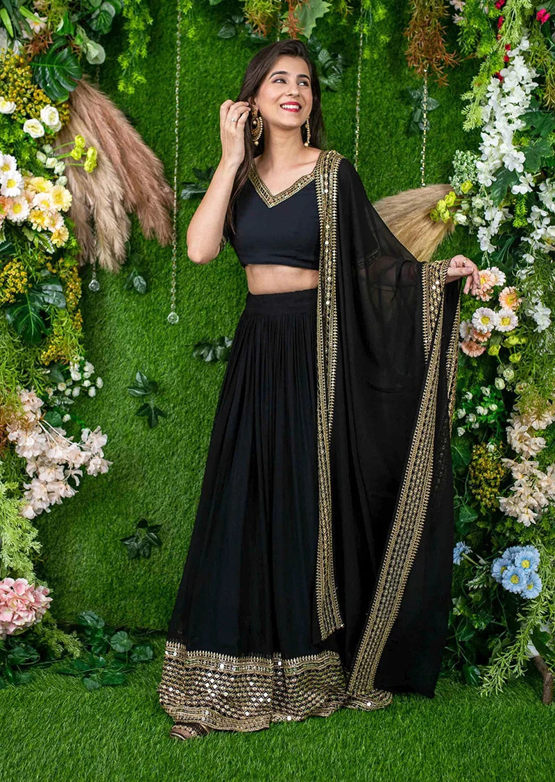 Black Georgette Mirror Work Lehenga Choli with Gold Trim, styled on model