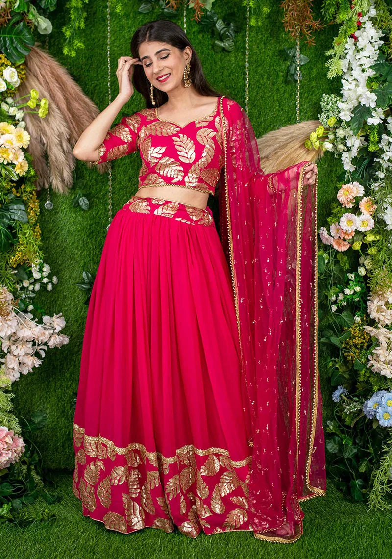 Rani Pink Georgette Foil Print Lehenga Choli with Leaf Motifs, styled on model