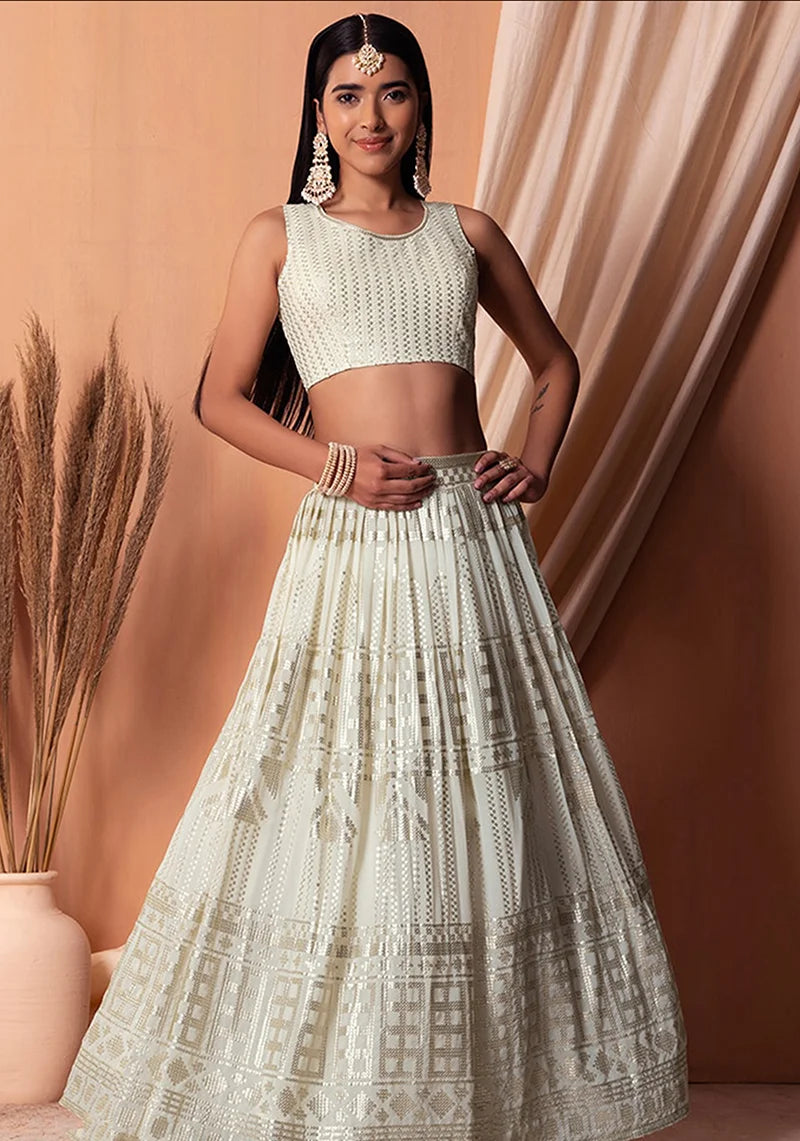 Off White Georgette Sequin Lehenga Choli with Foil Print, styled on model