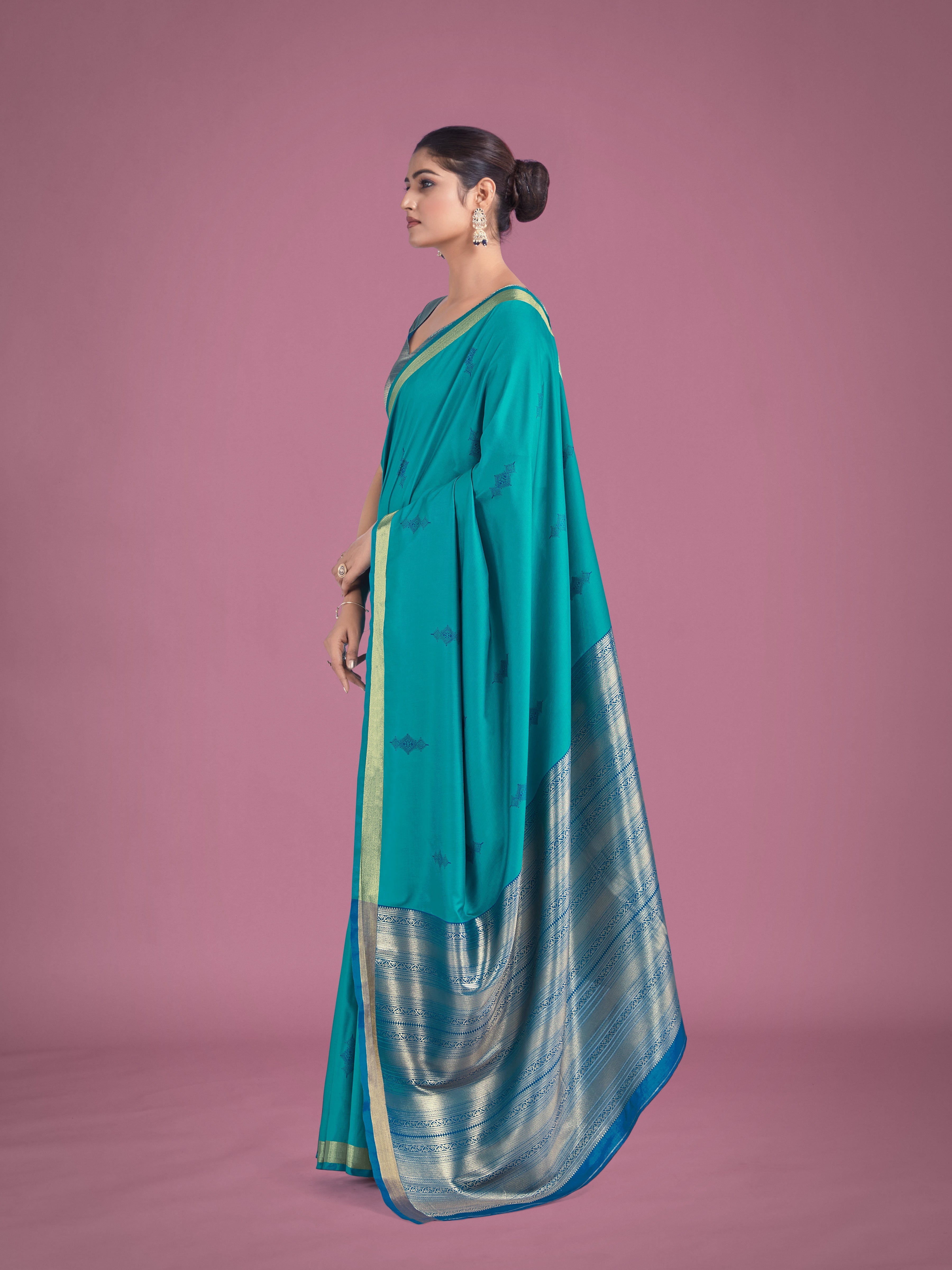 Charming Turquoise Color Silk Golden Zari Woven Ceremony Saree